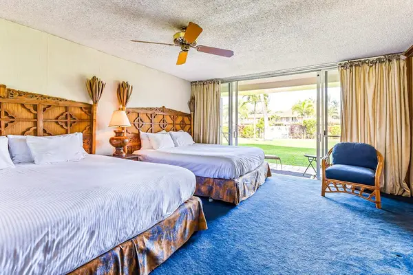 Wake up to peaceful garden views from this bright and inviting bedroom.