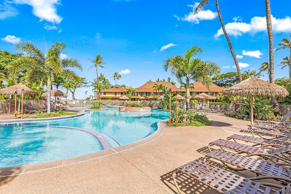 Relax by the resort-style pool surrounded by swaying palms and tropical landscaping.