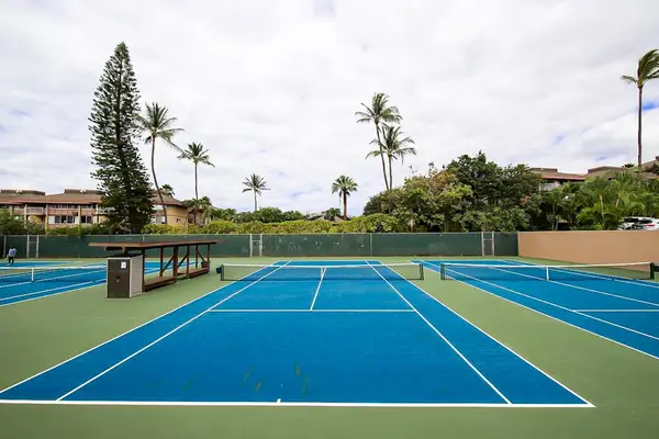 Serve up some fun on the tennis court surrounded by beautiful tropical scenery