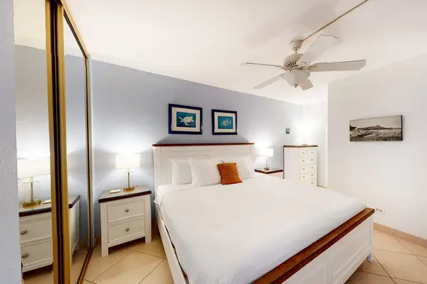 Guest room with king bed and local decor.