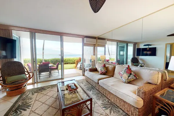 Enjoy the fresh ocean air in this comfortable living room when you open sliders.