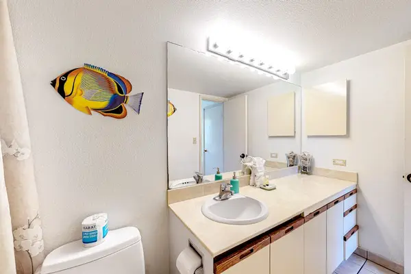 Spacious primary bathroom with plenty of counter and drawer space for your essentials