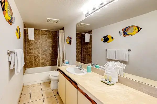 Bright primary bathroom with a bathtub perfect for a relaxing soak