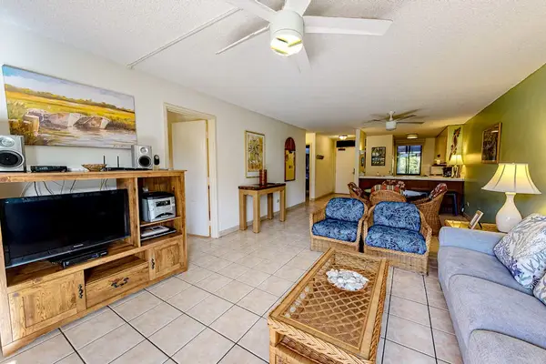 Spacious living area with TV and entertainment setup for your enjoyment