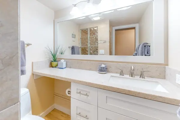 Bright bathroom with spacious vanity and generous counter space