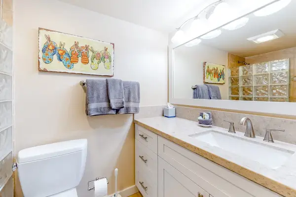 Full bathroom with convenient vanity and tub