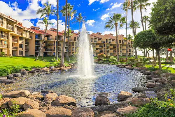Beautiful resort courtyard with fountain and lush greenery