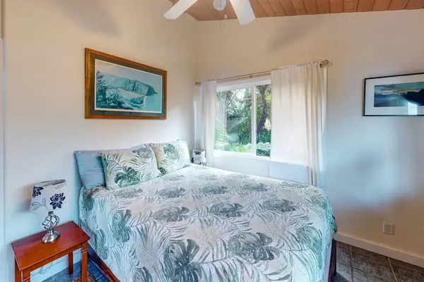 Cozy Corner View of Primary Suite with Ceiling Fan & Tropical Decor