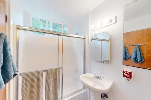 Private Primary En-Suite Bathroom with Glass Door Tub & Shower Combo