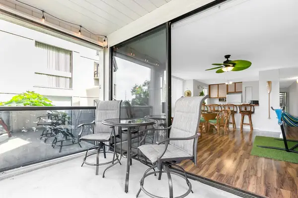 Private Covered Balcony with Patio Seating & Indoor-Outdoor Flow