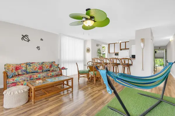 Spacious Tropical Living Area with Indoor Hammock & Kitchen Bar