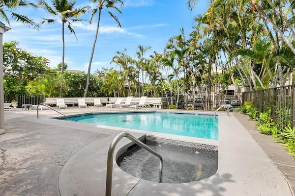 Resort-Style Swimming Pool & Hot Tub Surrounded by Tropical Palms
