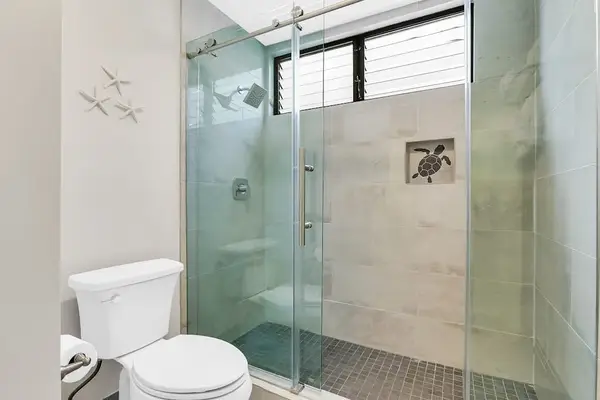 Modern Walk-In Glass Shower with Natural Light & Coastal Accents