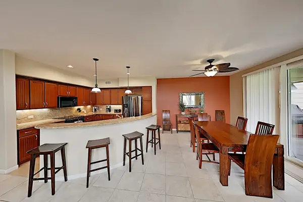 Large island for extra counter space and four barstools for extra seating.
