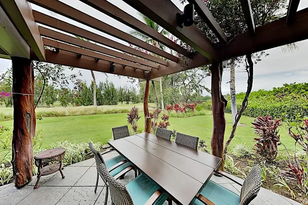 Outside covered dining with table and seating for six.  Cook a fabulous meal in your kitchen and take it outside to eat and enjoy your tropical views.