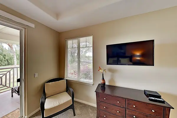 Master bedroom with flat screen tv and private lanai.