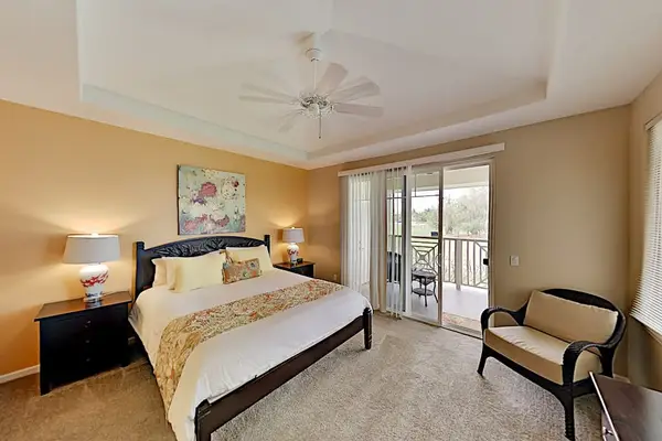 Master bedroom with king bed, private lanai and an en-suite bathroom