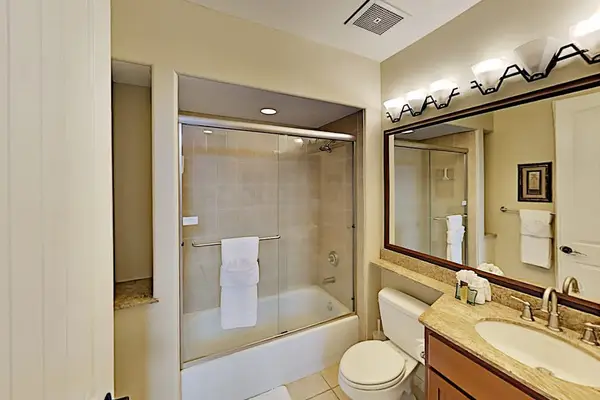 Guest bathroom with tub/shower combo.