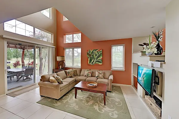 Comfortable living room with sofa bed for extra company, flat screen tv and lanai access.