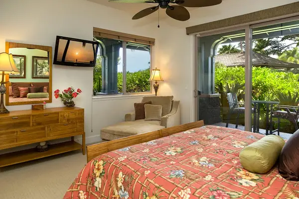 Bright Primary Bedroom with Flat-Screen TV, Chaise Lounge & Garden Views