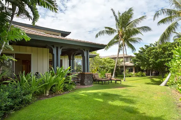 Private Patio & manicured Lawn Surrounded by Tropical Foliage