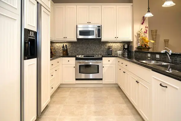 Full Kitchen Layout with Stainless Steel Appliances & Granite Counters