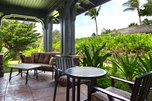 Covered Private Lanai with Outdoor Seating & Lush Garden Views