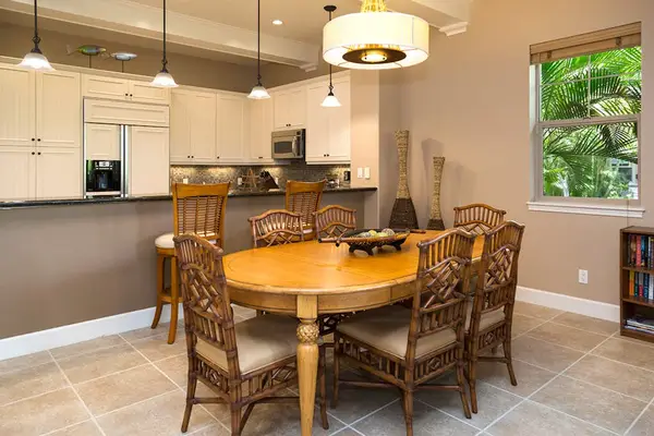 Elegant Dining Area with Seating for Six Adjacent to Kitchen Bar