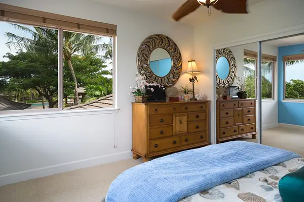 Bright Guest Bedroom with Large Windows & Built-In Mirrored Closet