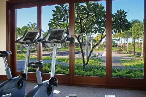 Fitness Center Stationary Bikes overlooking Pool & Gardens