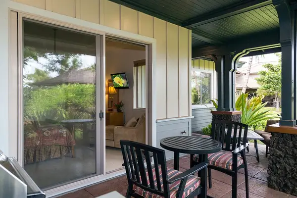 Covered Patio Seating & Outdoor Dining Area overlooking Lush Grounds