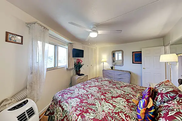 Comfortable bedroom with charming tropical touches
