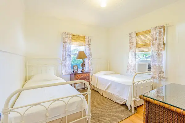 Two twin beds provide flexible sleeping arrangements for friends or family together