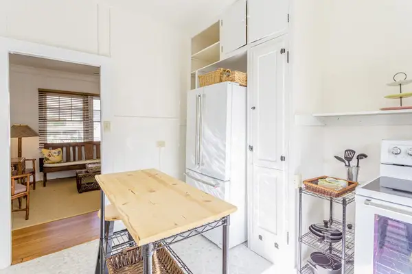 Gather around the wooden dining table for memorable meals and conversations together