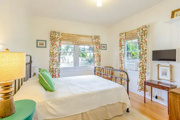 End every adventure with peaceful sleep in Cottage B's cozy queen bedroom