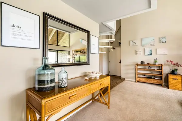 A welcoming entryway console that flows seamlessly right into the main living room