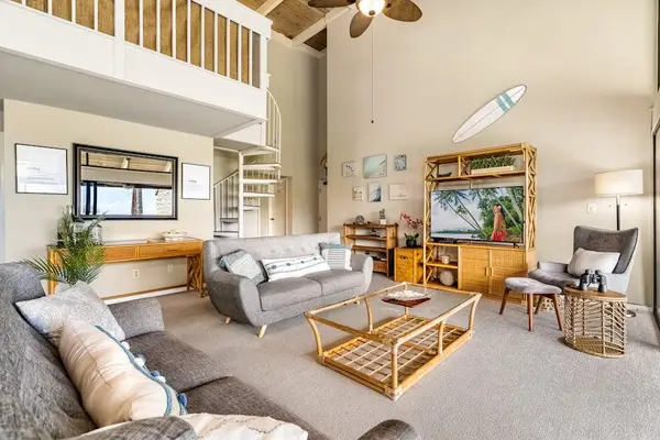 A cozy and inviting lounge space featuring a complete media center and plenty of room to unwind
