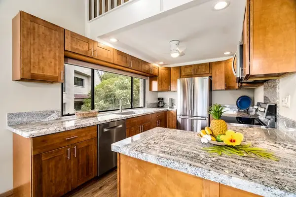 A fully equipped kitchen with modern appliances and ample counter space for preparing delicious meals
