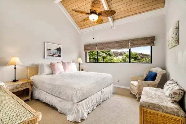 Relax in the spacious primary bedroom, complete with a dedicated reading nook and beautiful natural light