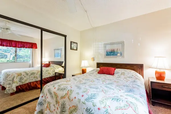 Bedroom With Wall-To-Wall Mirrors