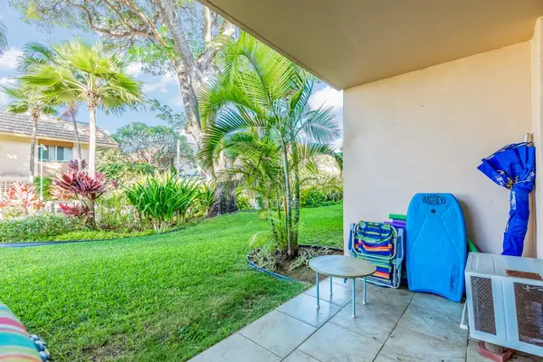 Covered Patio Surrounded By Tropical Greenery