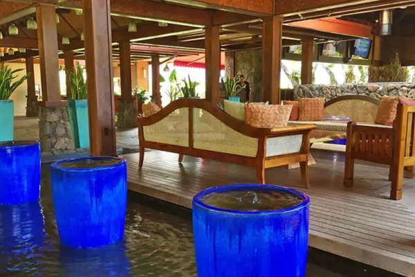 Gather comfortably in this open pavilion surrounded by tropical surroundings