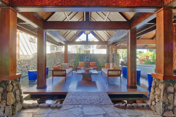 Unwind inside this breezy pavilion surrounded by peaceful tropical scenery