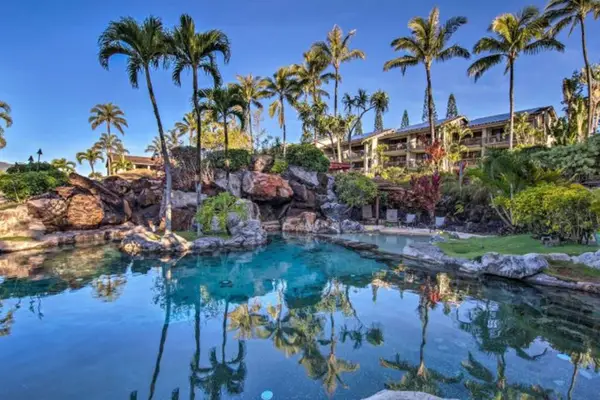 Sparkling resort pool offers a refreshing escape beneath tropical skies