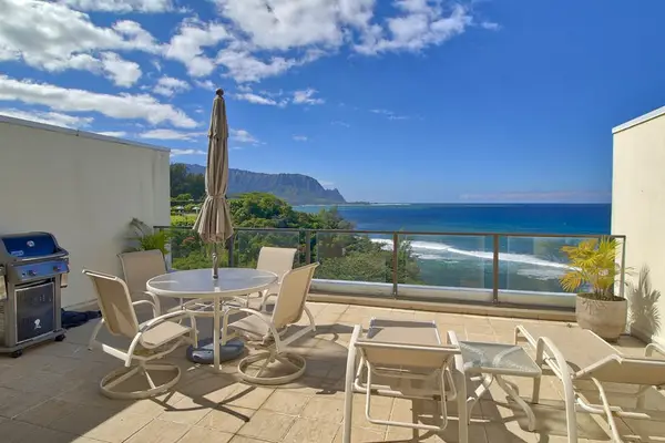 Cozy terrace offers outdoor dining, ocean scenery, and comfortable seating
