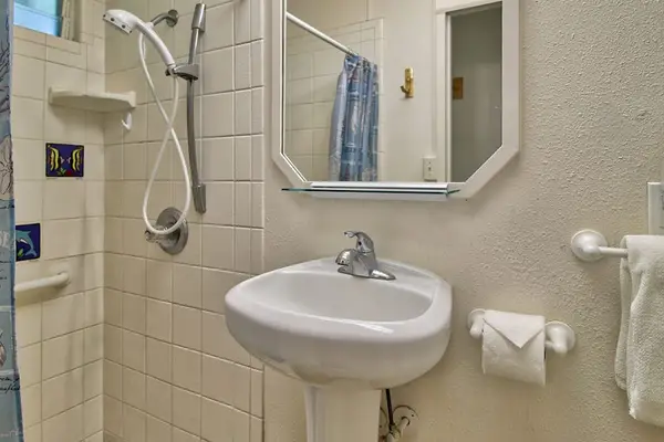 Well-appointed full bathroom with shower and everyday essentials.