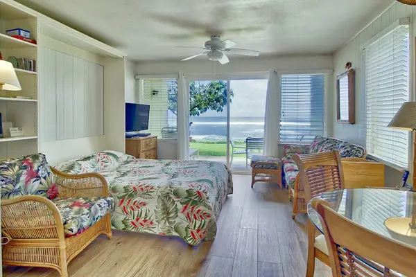 Open studio featuring comfortable furnishings and natural light throughout.