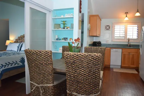 Enjoy a romantic dinner together at the dining table in the comfort of your home away from home.