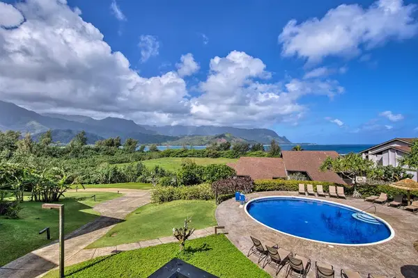 Sweeping resort views showcase lush greenery mountains and sparkling waters