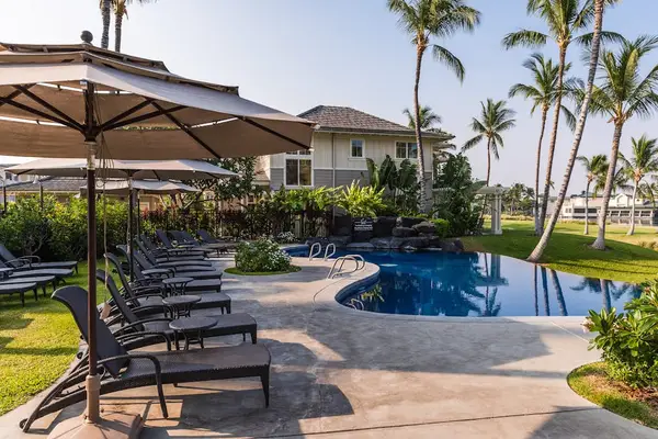 Resort Swimming Pool Deck with Sun Loungers & Umbrellas